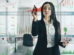 Dall’assicuratore al consulente multitasking: l’evoluzione dei professionisti della finanza. Donna in abito professionale che analizza grafici digitali di borsa e dati finanziari su un pannello trasparente virtuale, rappresentando l’uso della tecnologia nella consulenza finanziaria.