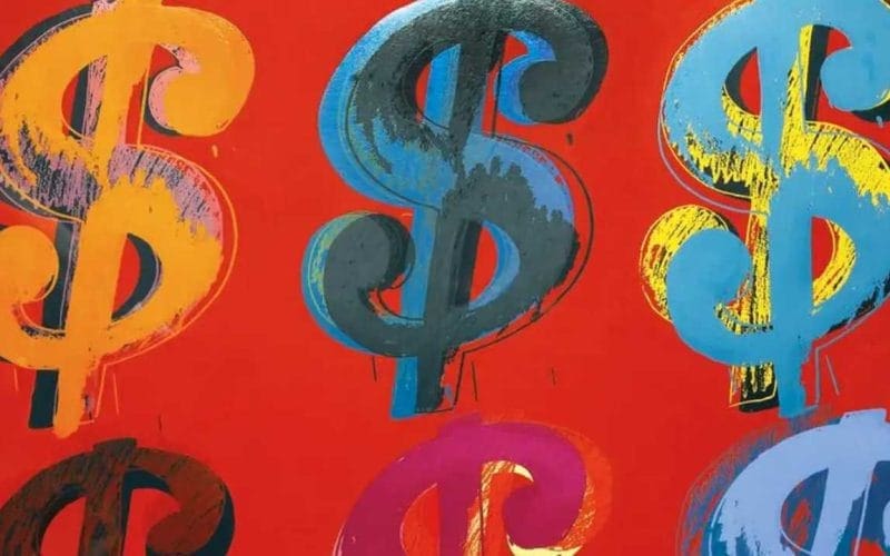Art lending. Opera pop art con sei simboli del dollaro colorati su sfondo rosso acceso; stile riconducibile a Andy Warhol, espressione della cultura del consumo e del denaro.