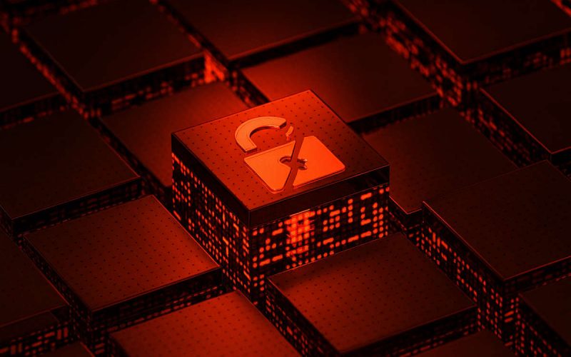 Rappresentazione digitale di un lucchetto rotto su blocchi tecnologici rossi, simbolo del rischio cyber post-pandemia e delle vulnerabilità informatiche delle imprese.